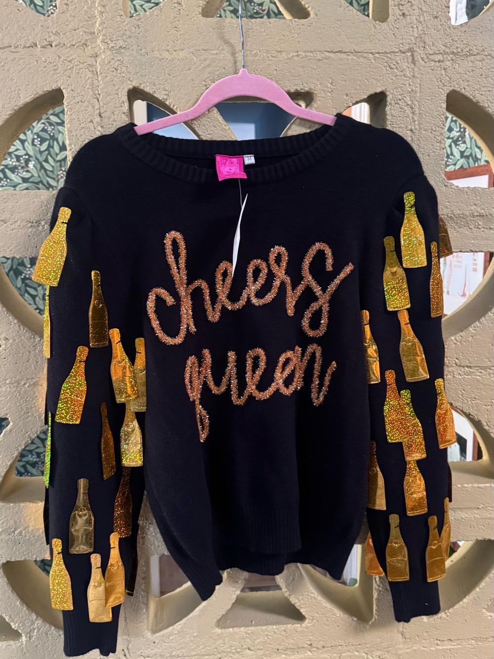 QUEEN OF SPARKLES Black Sweater with Gold Bottle Appliqués